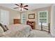 Bedroom features a ceiling fan, plush neutral carpet and two large windows with blinds at 1477 Edenham Ln, Cumming, GA 30041
