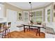 Eat-in kitchen featuring a dining table with bench seating and bright, natural light at 1477 Edenham Ln, Cumming, GA 30041