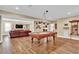 Large game room with a pool table, hardwood floors, and ample space for recreation and entertaining at 1477 Edenham Ln, Cumming, GA 30041