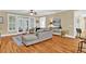 Comfortable living room showcasing hardwood floors, views to the porch, and a decorative table at 1477 Edenham Ln, Cumming, GA 30041