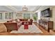 Inviting living room with plush brown sectional sofa, light fixture, and modern décor creating a cozy and stylish ambiance at 1477 Edenham Ln, Cumming, GA 30041