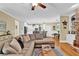 Bright living room offering modern furnishings, hardwood floors, and great lighting at 1477 Edenham Ln, Cumming, GA 30041