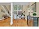 Bright and airy living room featuring hardwood floors, soaring windows, and elegant staircase at 1477 Edenham Ln, Cumming, GA 30041