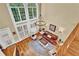Overhead view of the sun-filled living room with hardwood floors, tall windows, and comfortable seating at 1477 Edenham Ln, Cumming, GA 30041