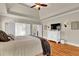 Spacious main bedroom showcasing vaulted ceiling, hardwood floors and french doors at 1477 Edenham Ln, Cumming, GA 30041