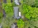 Aerial view showcasing a home surrounded by mature trees and lush landscaping at 1728 N Holly Ne Ln, Atlanta, GA 30329