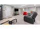 Finished basement with grey paint, carpet, TV, and comfortable seating at 1728 N Holly Ne Ln, Atlanta, GA 30329