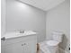 Half bathroom features a vanity with storage and a toilet at 1728 N Holly Ne Ln, Atlanta, GA 30329