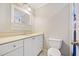 Bathroom featuring a toilet, sink, and shower with beach scene curtain at 1728 N Holly Ne Ln, Atlanta, GA 30329