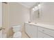 Clean bathroom featuring vanity with drawers and cabinets plus a toilet at 1728 N Holly Ne Ln, Atlanta, GA 30329