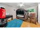 Bedroom with hardwood floors, a piano, and a unique tented bed at 1728 N Holly Ne Ln, Atlanta, GA 30329