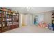 Bright bedroom with a large bookcase, sliding glass door, and ample natural light at 1728 N Holly Ne Ln, Atlanta, GA 30329