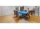 Dining room with a blue tablecloth, hardwood flooring, and bright lighting at 1728 N Holly Ne Ln, Atlanta, GA 30329