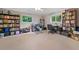 Spacious home office with built in shelving, overhead lighting, and carpeted floors at 1728 N Holly Ne Ln, Atlanta, GA 30329