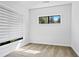Bright bedroom with carpet, window with blinds, recessed lighting, and white walls at 22 Moda Ln, Atlanta, GA 30316