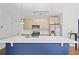 Modern kitchen with large island, stainless appliances, and pendant lighting at 22 Moda Ln, Atlanta, GA 30316