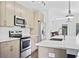 Clean kitchen with modern stainless steel appliances, stylish counters, and wood floors at 22 Moda Ln, Atlanta, GA 30316
