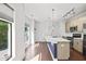 Modern kitchen with stainless steel appliances, hardwood floors, and center island at 22 Moda Ln, Atlanta, GA 30316