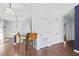 Bright living room with dark hardwood floors, white walls, modern lighting, and eat-in counter with barstool seating at 22 Moda Ln, Atlanta, GA 30316