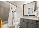 Charming bathroom with fun decorations, gray tile, and granite countertops at 2861 Digna Ct, Acworth, GA 30101