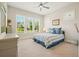 Cozy bedroom with plush carpeting, natural light from the windows, and classic decor at 2861 Digna Ct, Acworth, GA 30101