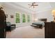 Bedroom with a tray ceiling, ceiling fan and three windows at 2861 Digna Ct, Acworth, GA 30101