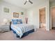 Comfortable bedroom with neutral walls, ceiling fan, and bathroom access for convenience at 2861 Digna Ct, Acworth, GA 30101