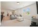 Versatile bonus room with ample natural light, neutral colors, and comfortable seating area at 2861 Digna Ct, Acworth, GA 30101