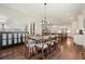Open dining area with dark wood floors, chandelier lighting, and easy access to kitchen and living spaces at 2861 Digna Ct, Acworth, GA 30101