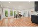 An open dining area boasts wood-look floors, natural light, and easy access to the kitchen and outdoor spaces at 2861 Digna Ct, Acworth, GA 30101