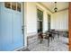 Inviting front porch with a comfortable seating area and stylish light fixture at 2861 Digna Ct, Acworth, GA 30101