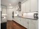 Kitchen features white cabinetry, granite countertops, stainless vent hood, and gas range at 2861 Digna Ct, Acworth, GA 30101