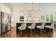 Bright kitchen with a large island, stainless steel appliances, and modern pendant lighting at 2861 Digna Ct, Acworth, GA 30101