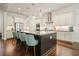 Bright kitchen with a large island, stainless steel appliances, and modern pendant lighting at 2861 Digna Ct, Acworth, GA 30101