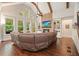 Open concept living room with brick fireplace, built-in shelving, and large windows at 2861 Digna Ct, Acworth, GA 30101