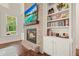 Inviting living area with brick fireplace, custom built-ins, and modern entertainment center at 2861 Digna Ct, Acworth, GA 30101