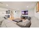 A comfortable living room features a large sectional, wet bar, and modern entertainment center with large screen TV at 2861 Digna Ct, Acworth, GA 30101