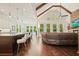 Open-concept living space, featuring kitchen island, living area and hardwood floors at 2861 Digna Ct, Acworth, GA 30101