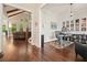 Open-concept living spaces featuring a home office and a living room with vaulted ceilings and brick fireplace at 2861 Digna Ct, Acworth, GA 30101