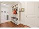 Mudroom with built-in storage, seat, and easy access to laundry room and outside entry at 2861 Digna Ct, Acworth, GA 30101
