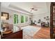 Bright office with large windows, hardwood floors, ceiling fan, and modern furniture at 2861 Digna Ct, Acworth, GA 30101