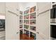 Walk-in pantry with white shelving, filled with ample food storage at 2861 Digna Ct, Acworth, GA 30101