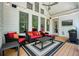 Covered porch with seating area, ceiling fan, and outdoor kitchen, perfect for entertaining at 2861 Digna Ct, Acworth, GA 30101