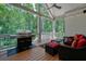 Covered porch with outdoor kitchen, grill and seating area, perfect for entertaining with a wooded view at 2861 Digna Ct, Acworth, GA 30101