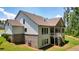 Exterior view of home featuring white siding, brick foundation, and a covered back porch at 2861 Digna Ct, Acworth, GA 30101