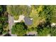 Aerial view of property showcasing a well-maintained yard, deck with umbrella, modern driveway and mature trees at 1377 Oak Grove Dr, Decatur, GA 30033