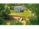 Aerial shot of a large backyard with privacy fence, deck, and a creek with bridge at 1377 Oak Grove Dr, Decatur, GA 30033