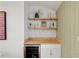 Stylish wet bar with a mini fridge and open shelves, perfect for entertaining guests at 1377 Oak Grove Dr, Decatur, GA 30033