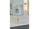 Stylish bathroom featuring quartz countertops, gold fixtures, and modern lighting at 1377 Oak Grove Dr, Decatur, GA 30033