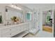 Updated bathroom features double sinks, stylish vanity, and a walk-in glass shower at 1377 Oak Grove Dr, Decatur, GA 30033